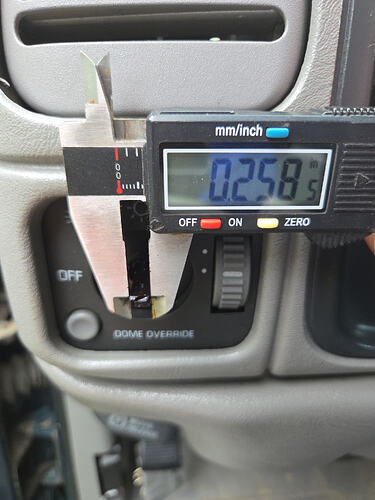 Measuring OBS headlight switch shaft width with caliper for Express knob swap