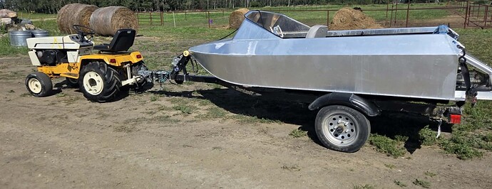 Cub Cadet 1450 towing a jet boat