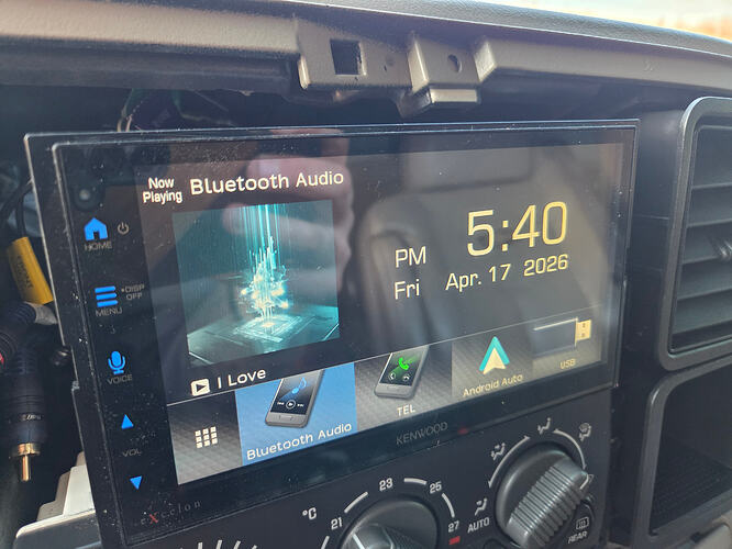 GMT800 Plastic tab shown above the stereo. You'll have to cut this to get a Double din into the dash.