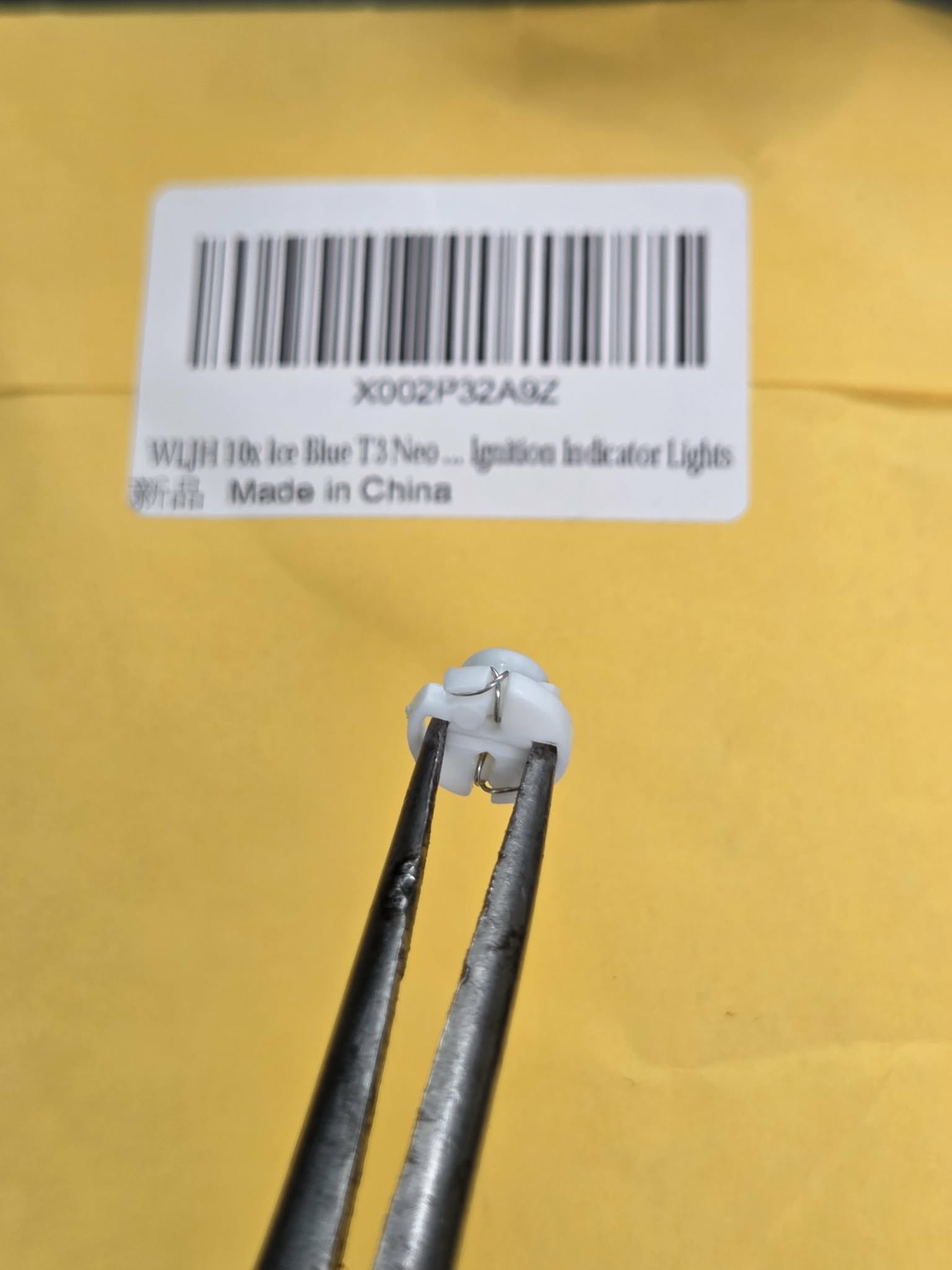 Installing T3 LED bulb into headlight switch using needle nose pliers OBS